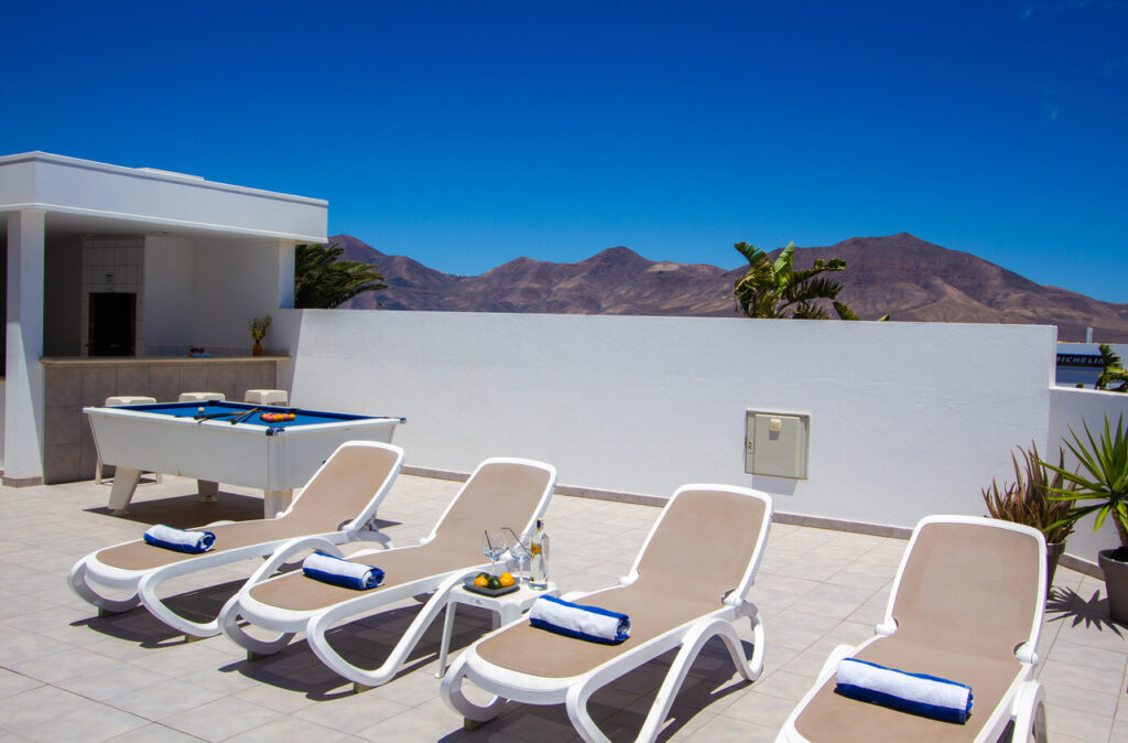 Casa Maelle pool table and sun lounging area