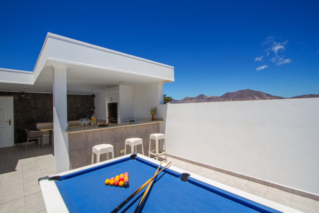 Casa Maelle pool table and sun lounging area