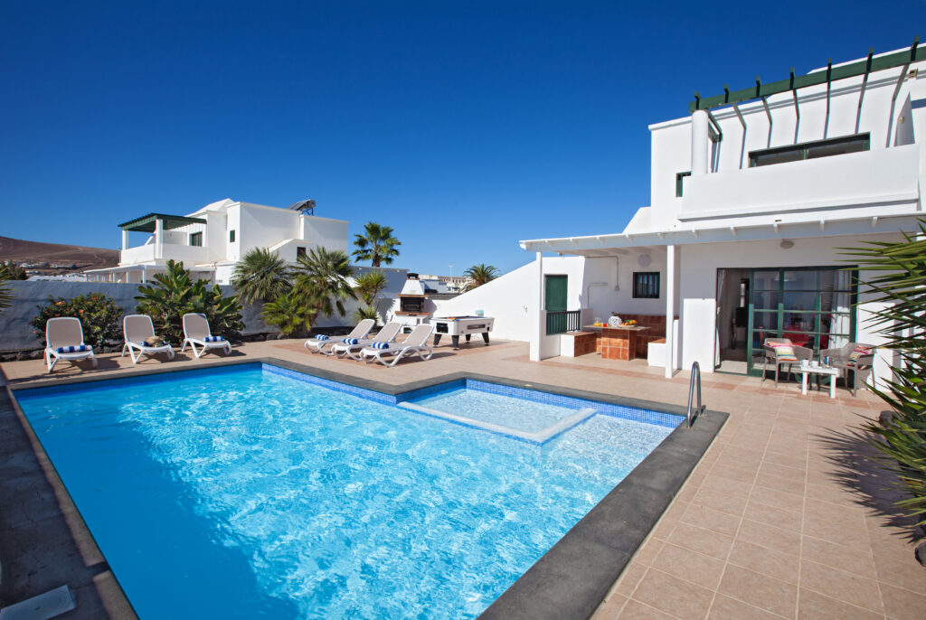 Villa Vicini pool area with sun loungers